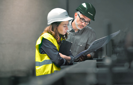 Two people planning an order in a warehouse Two people planning an order in a warehouse